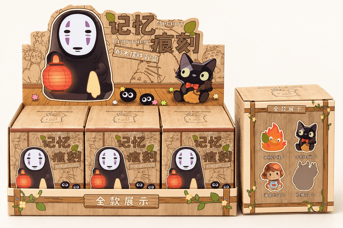 Ghibli No-Face blind box display tray with sealed boxes and box side showing other figures - OVERRATED