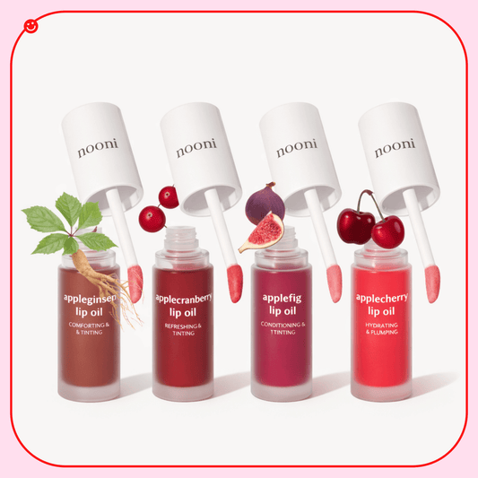 Nooni Apple lip oil lineup of four bottles, appleginseng, applecranberry, applefig and applecherry - OVERRATED