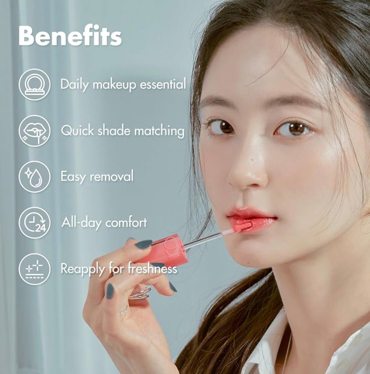 Romand Dewyful Water Tint Cotton Melba model holding tint bottle closeup - Overrated Korean Beauty & More